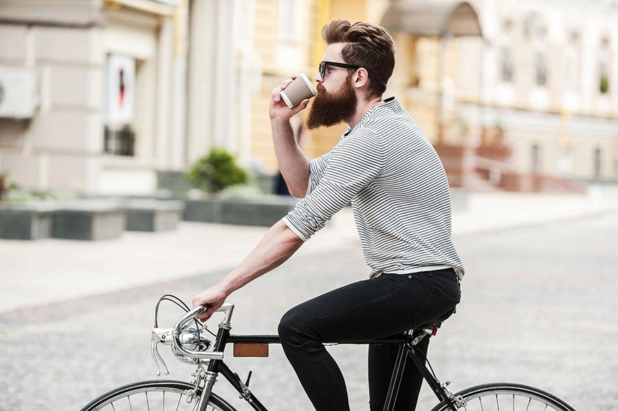 man-drinking-coffee-on-bike.jpg