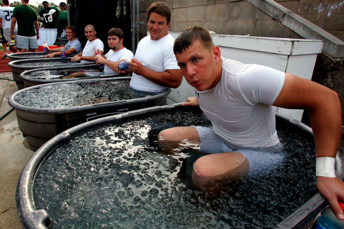 tulane-tight-end-justin-kessler-l-takes-his-time-getting-into-his-ice-bath-ice-tub-for-athletes-8-1365-x-910.jpg
